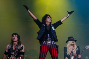 Alice Cooper, flanked by Ryan Roxie and Orianthi (publicity photo)